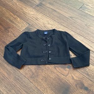 Black 4 button sweater.  Size 18-24 months.  Button bows